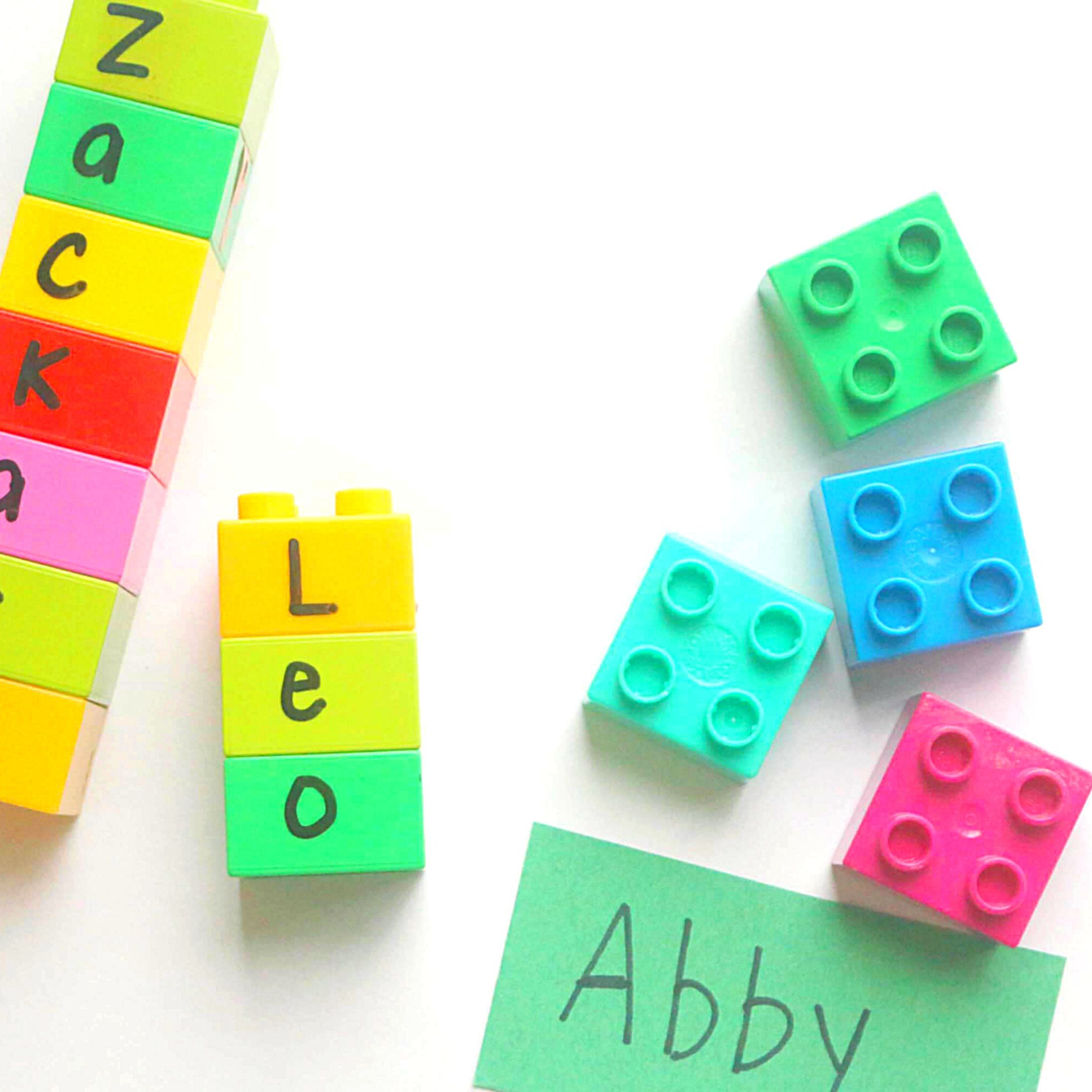 Image of LEGO Duplo blocks stacked to spell names of preschoolers