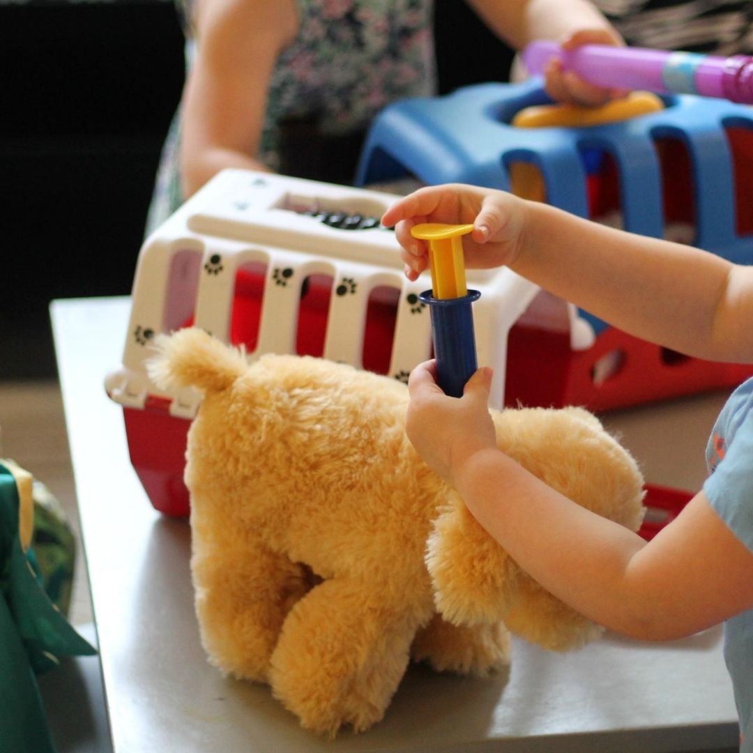 Preschool animals pretend vet activity with doctor kit and stuffed animals.