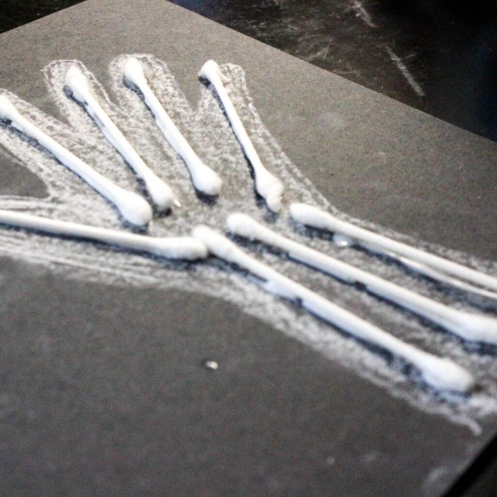 Skeleton of hand with bones created by q-tips preschool craft