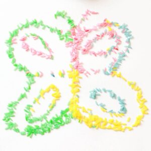 Butterfly preschool craft with rainbow rice.