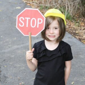 Girl holding a stop sign