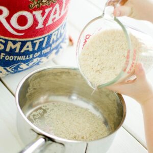 Cooking white rice in a pot.