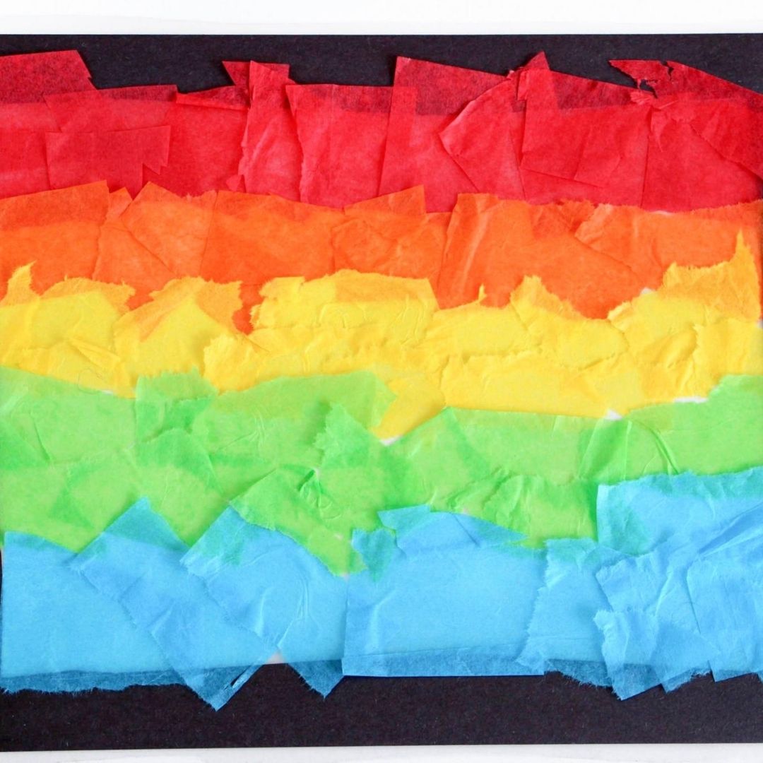 Rainbow made with colored tissue paper preschool craft for spring.