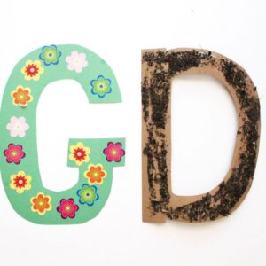 Decorate the letter g like a garden and the letter d like dirt.