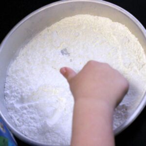 Preschool winter activity. Draw emotions in flour.